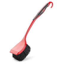 Red scrub brush with black bristles and flat angled cleaning head