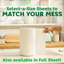 White paper towel roll with sheet being pulled from dispenser on countertop