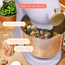 Stand mixer pastry beater attachment mixing dough inside stainless bowl