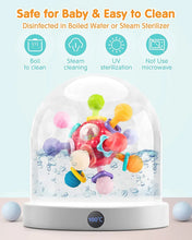Red sensory teething ball rattle toy in a clear sterilizing dome with water droplets