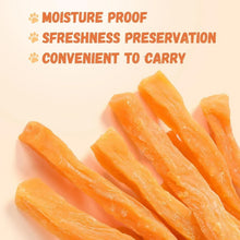 Orange sweet potato dog treat sticks, angled close-up
