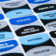 Word game category cards laid out on letter-tile board with blue and white tiles