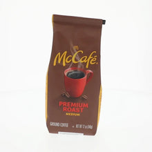 Ground coffee bag with gold McCafe logo, Premium Roast, medium, ground coffee