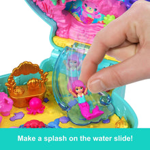 Compact playset water slide section with tiny mermaid doll and seashell pieces