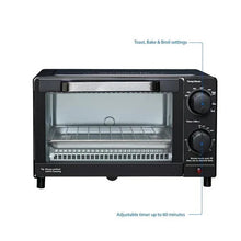 Black countertop toaster oven front view with two control knobs and wire rack