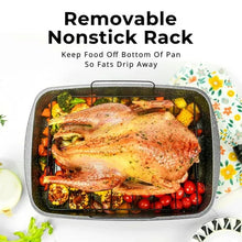 Speckled roasting pan with removable nonstick rack, holding roast chicken