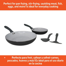 Two gray fry pans with gray handles and matching utensil tools set