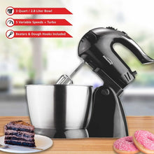 Black stand mixer with stainless steel bowl and beater beaters, front view