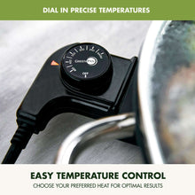 Electric skillet temperature dial on black base with heat level indicators