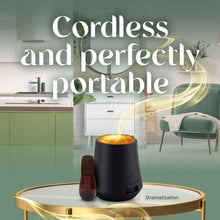 Cordless essential mist oil diffuser with small amber refill bottle, black base and gold lid