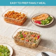 Clear glass meal prep containers with snap lids holding prepared meals