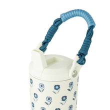 Tall stainless steel water bottle with blue paracord handle, white body with blue floral print