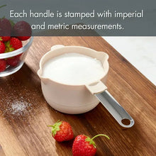 Light gray measuring cup with stainless steel handle