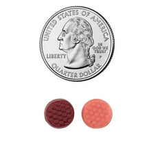 Two multivitamin gummies beside a US quarter showing relative size