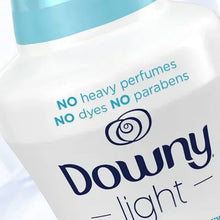 Scent booster beads bottle label reading Downy Light with 'No heavy perfumes' and 'No dyes'.