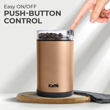 Electric coffee grinder in copper with clear push-top lid and one-touch switch
