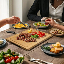 Bamboo cutting board on countertop with juice groove for slicing and serving food