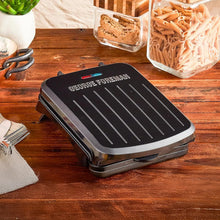 George Foreman electric indoor grill with black non-stick grill plates