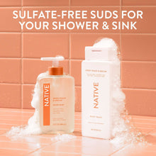 Hand soap bottles with orange pumps, Sweet Peach & Nectar, with overflowing white foam