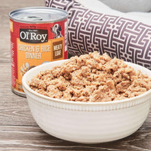 Ol' Roy wet dog food can beside a bowl of cooked loaf-style dog food