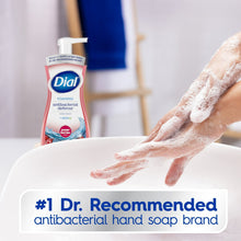 Foaming antibacterial hand soap bottle with aloe; foamy hands shown