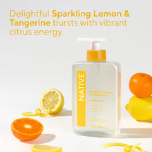 Native sparkling lemon & tangerine hand soap bottle with citrus fruit beside it