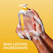 Native hand soap bottle with foamy lather in hands
