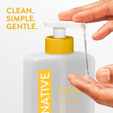 Native hand soap bottle with yellow pump being dispensed by hand and droplet