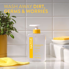 Native sparkling lemon & tangerine hand soap bottle with yellow pump on counter