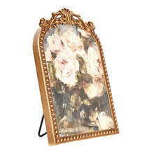Gilded tabletop floral art with ornate filigree iron frame, standing display easel