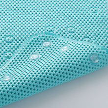 Aqua cushioned foam bathtub mat with textured surface and round suction cups