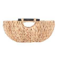 Woven water hyacinth decorative bowl with cutout sides and two wooden-look handles