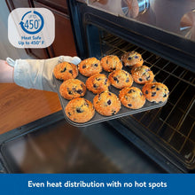 Gray nonstick muffin pan with baked muffins inside oven rack