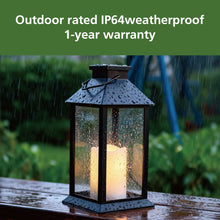 Black solar lantern with water droplets on glass panels, handle and roof for outdoors.
