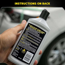 Hand holding Meguiar's PlastX clear plastic polish bottle with back label