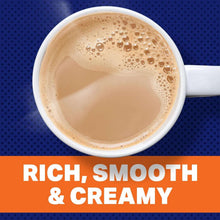 Cup of creamy light-brown instant café-style beverage with foam on top