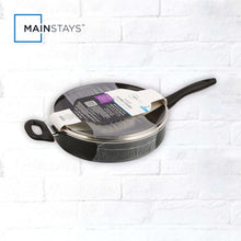 Black non-stick frying pan with glass lid in retail packaging