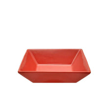 Red square stoneware serving bowl with faceted edges and glossy finish