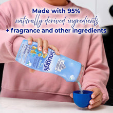 Snuggle Blue Sparkle scent booster bottle being poured into a blue cup