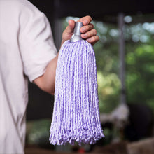 Lavender microfiber mop head refill held in hand, fringe strands down
