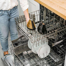 Dishwasher rack with plates and silverware baskets.