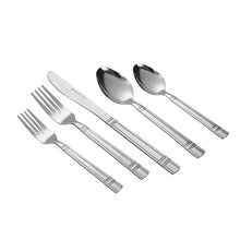 Stainless steel flatware set with forks, knives, and spoons laid out