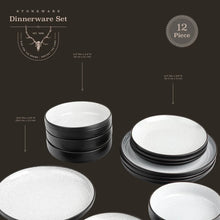 Stacked white ceramic dinnerware plates with black rims, shown in set layout
