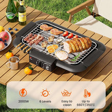 Electric smokeless grill on a wooden deck with skewers, vegetables, and sliced meat.