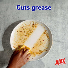 Dish plate with grease splatter and foam, with Ajax Ultra logo in corner