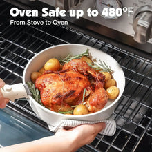 White speckled roasting pot on a wire oven rack, with handles on sides