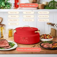 Red electric multi-cooker on countertop with handle lid