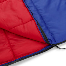 Youth sleeping bag close-up: red and blue panels with black zipper
