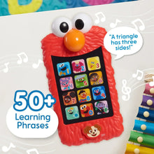 Red Elmo learning phone with white eyes, orange nose, and character keypad screen