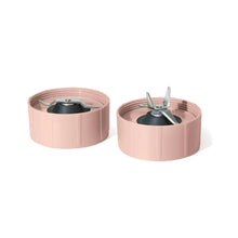 Rose blender accessory tops with clear lids and black cutting blades, two pieces shown